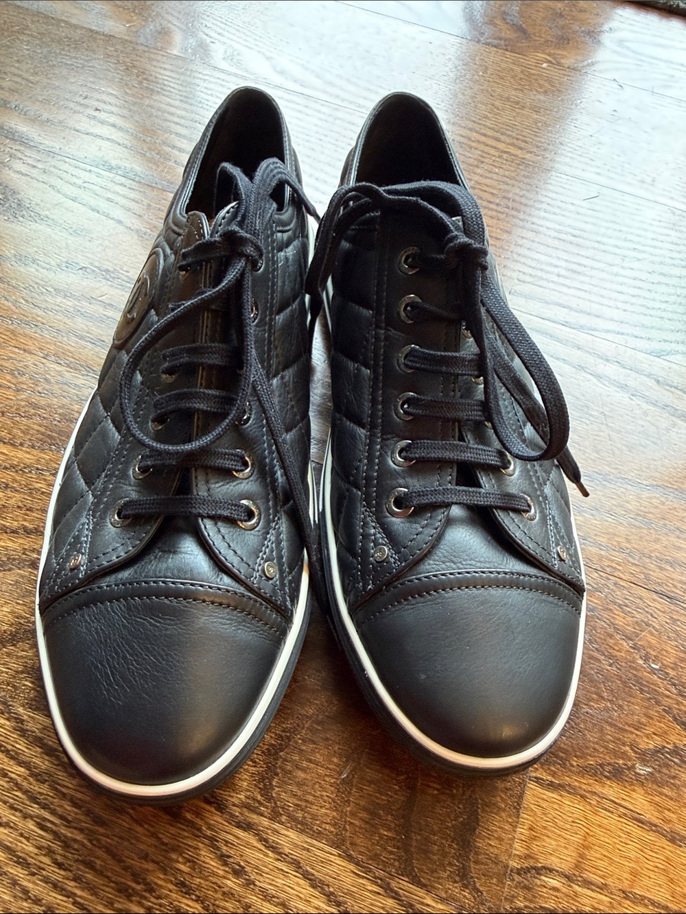 CHANEL Black Quilted Leather Sneakers with White Trim
